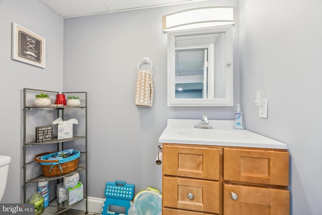 bathroom featuring vanity and toilet