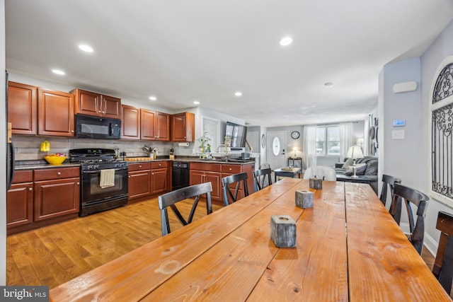 interior space featuring sink and light hardwood / wood-style floors