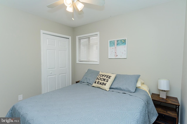 bedroom featuring ceiling fan and a closet