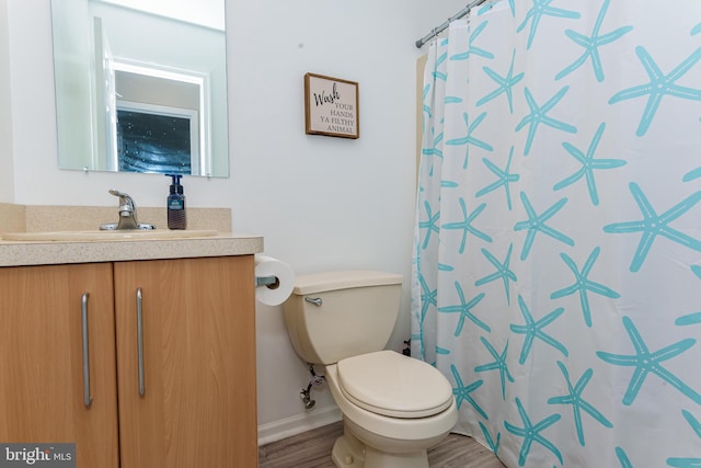 bathroom with a shower with shower curtain, vanity, toilet, and wood-type flooring