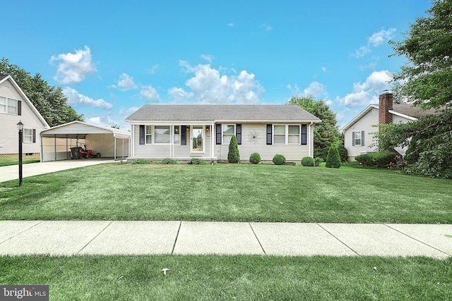 view of front of property with a carport and a front lawn