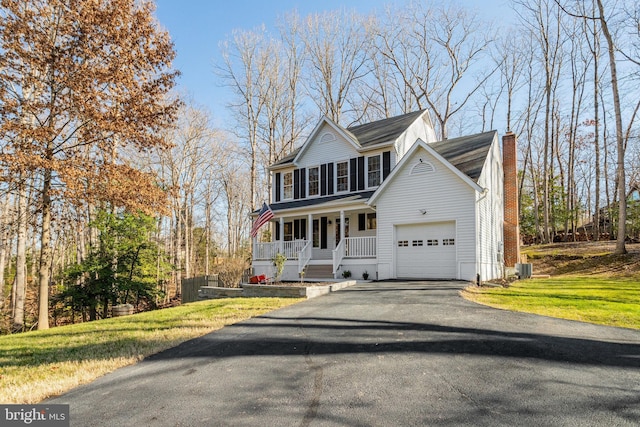 view of property featuring a front yard and a porch