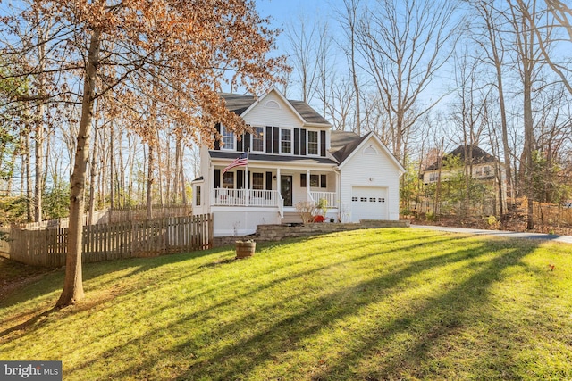 front facade with a front lawn, a porch, and a garage