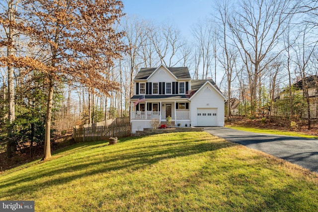 view of property with covered porch and a front lawn