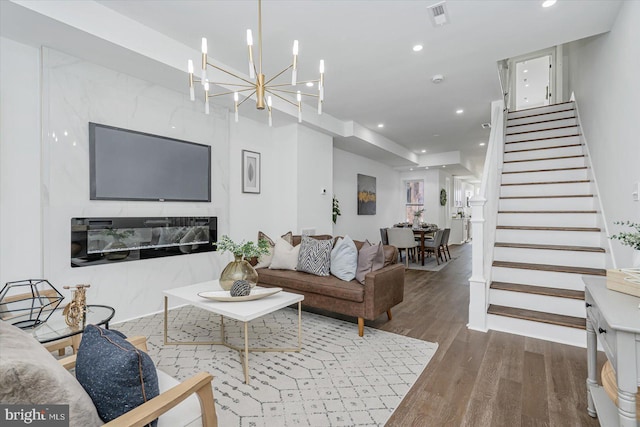 living room with hardwood / wood-style flooring and a premium fireplace