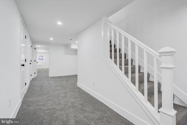 hallway with carpet floors