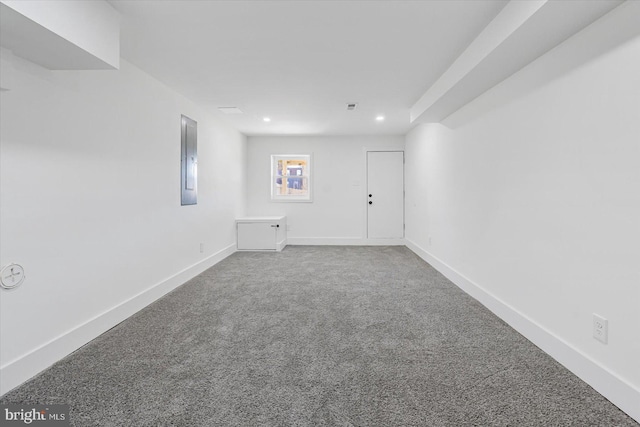 spare room with carpet floors and electric panel