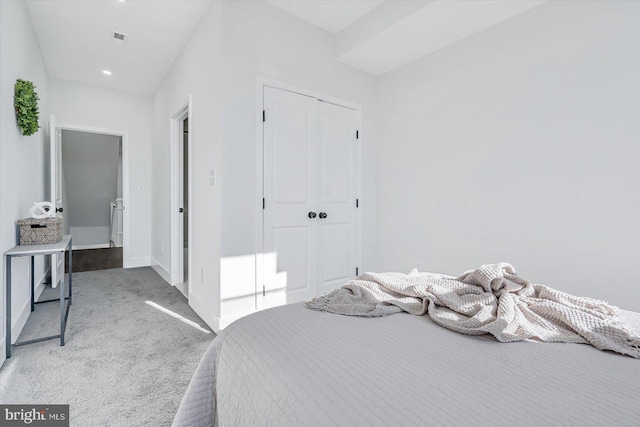 bedroom with carpet flooring and a closet