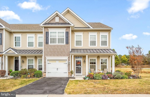 view of front of house featuring a garage and a front yard