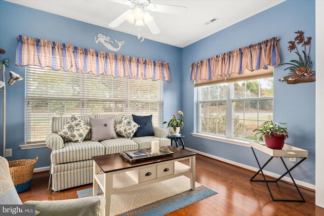 living room with ceiling fan and wood-type flooring