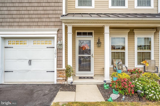 doorway to property featuring covered porch