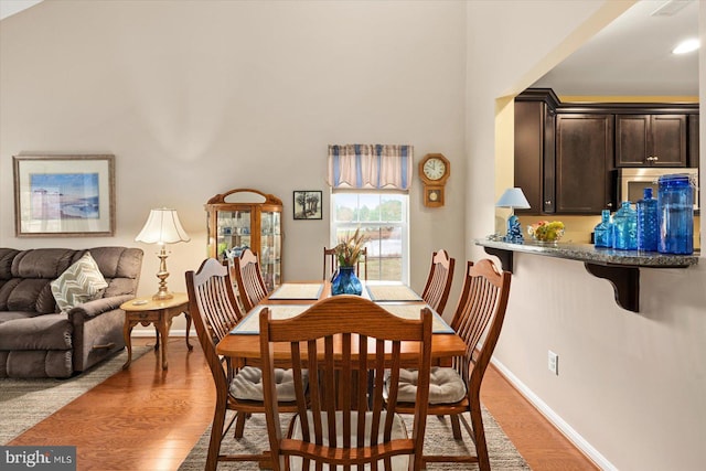 dining area with light hardwood / wood-style flooring