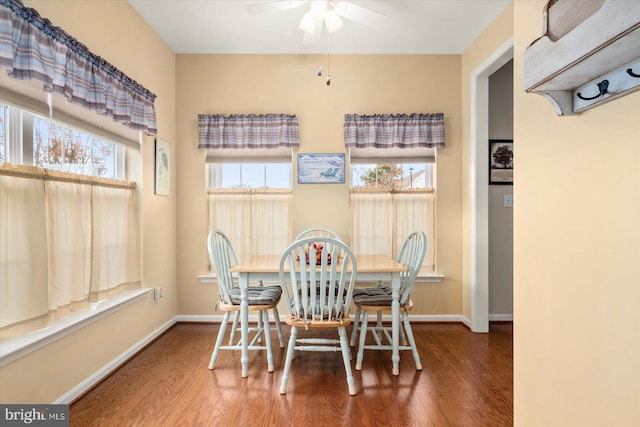 dining space with hardwood / wood-style flooring and ceiling fan