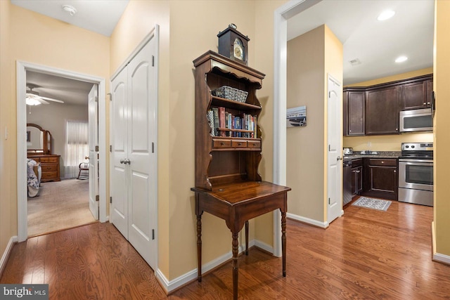 hall with wood-type flooring