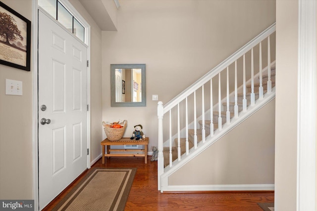 foyer with dark wood-type flooring