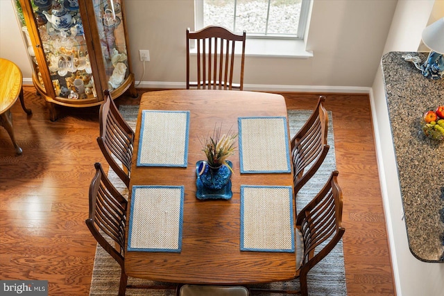 dining room with hardwood / wood-style floors