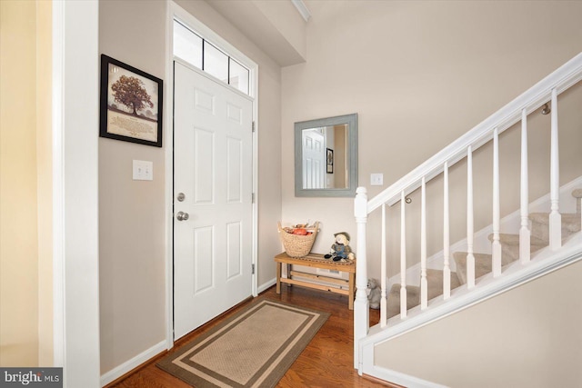 entrance foyer featuring dark hardwood / wood-style floors