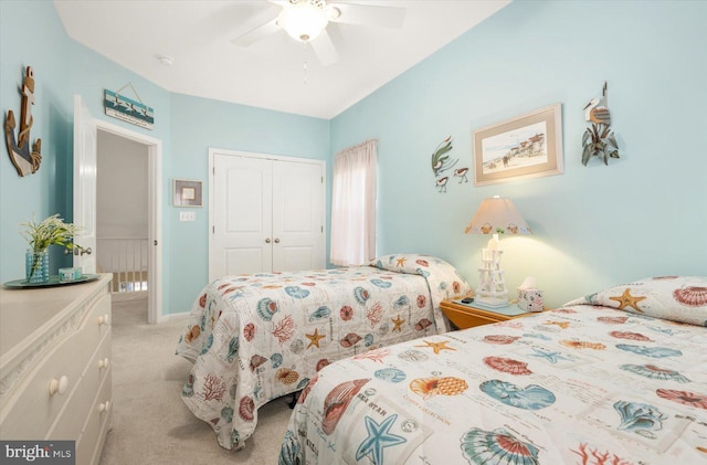 bedroom featuring light carpet, a closet, and ceiling fan