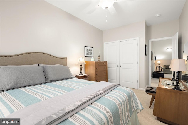 bedroom with light carpet, a closet, and ceiling fan