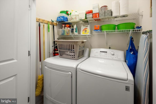 washroom featuring independent washer and dryer