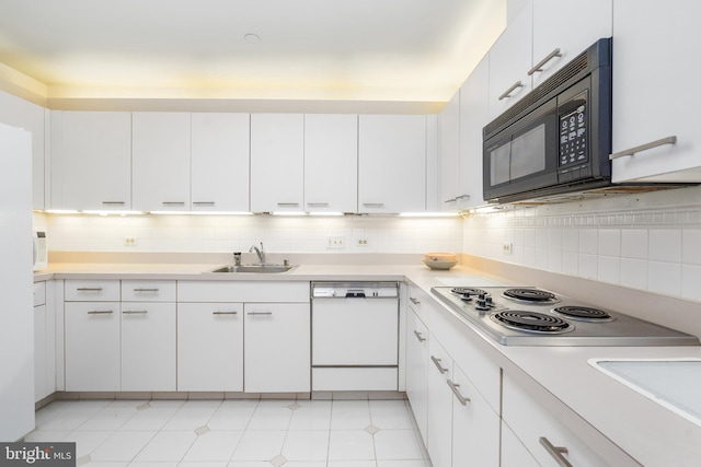 kitchen with white cabinets, white appliances, tasteful backsplash, and sink