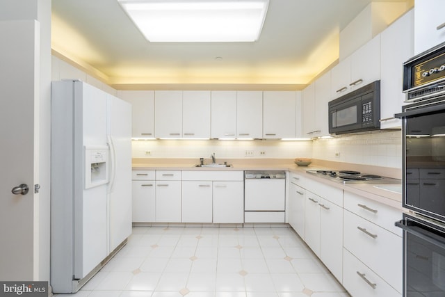 kitchen featuring white cabinets, decorative backsplash, white appliances, and sink