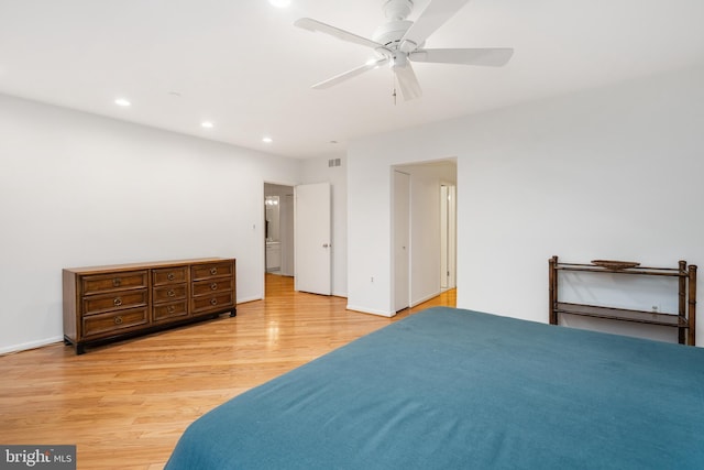 bedroom with ceiling fan and light hardwood / wood-style floors