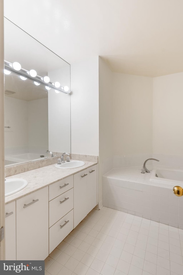 bathroom featuring tile patterned flooring and vanity