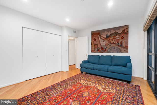 sitting room with hardwood / wood-style floors