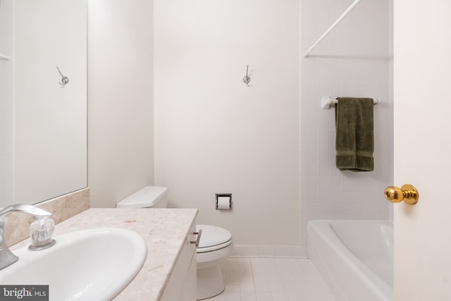 bathroom with tile patterned flooring, vanity, and toilet