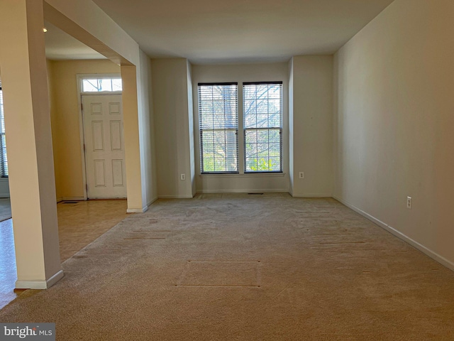 entrance foyer with carpet and baseboards