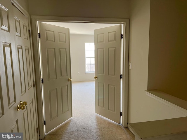 corridor featuring carpet flooring