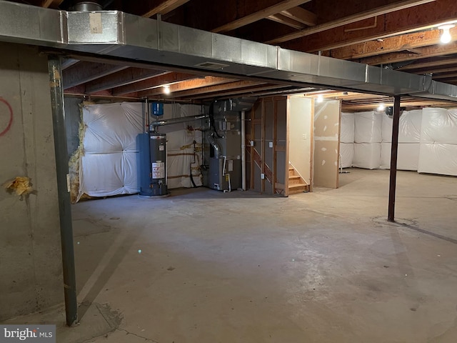 unfinished basement featuring heating unit, stairs, and water heater