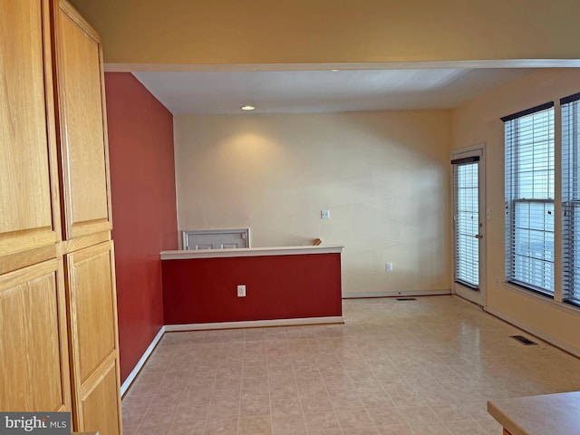 interior space featuring visible vents and baseboards