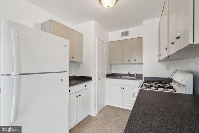 kitchen featuring light carpet, sink, and white appliances