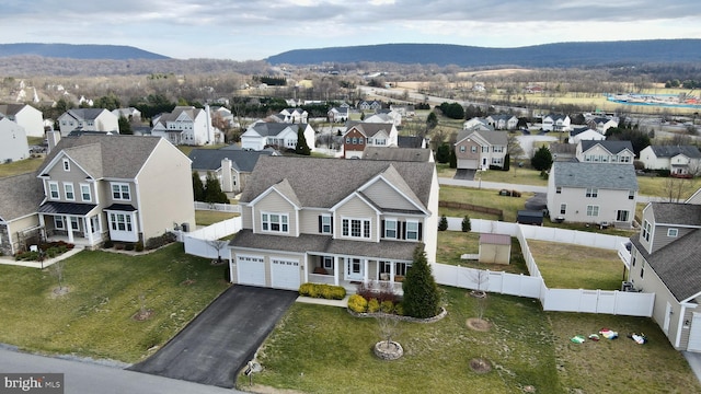 birds eye view of property with a mountain view