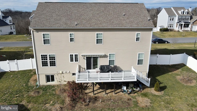 rear view of house with a wooden deck