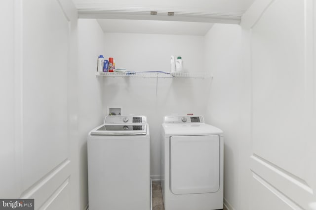 laundry area with washing machine and clothes dryer