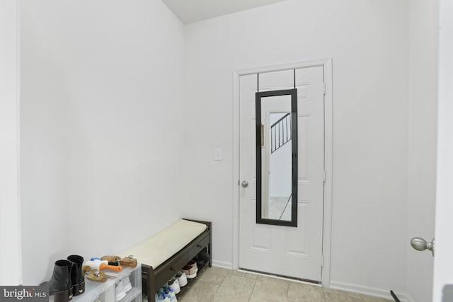 doorway featuring light tile patterned floors