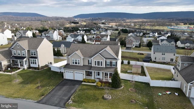 drone / aerial view featuring a mountain view