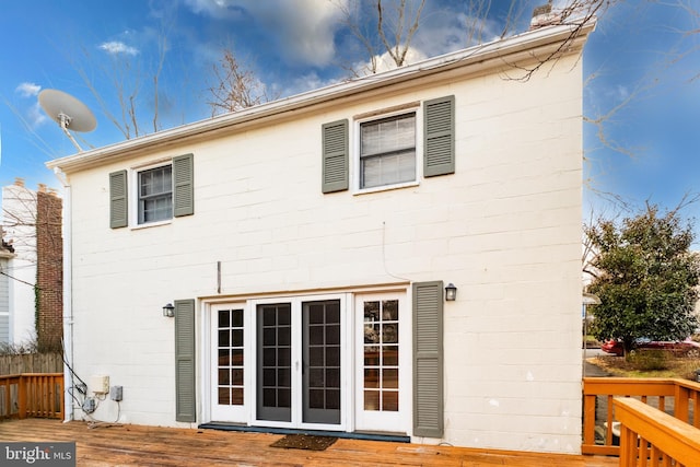 rear view of property with a wooden deck