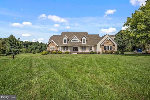 cape cod-style house featuring a front lawn