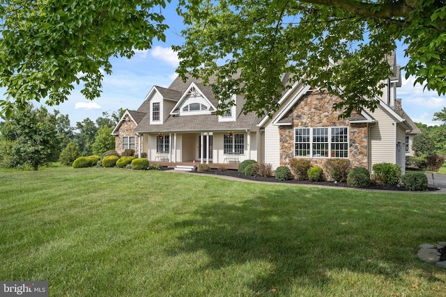 view of front facade with a porch and a front yard