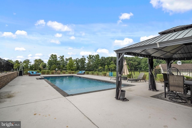 view of swimming pool with a gazebo and a patio