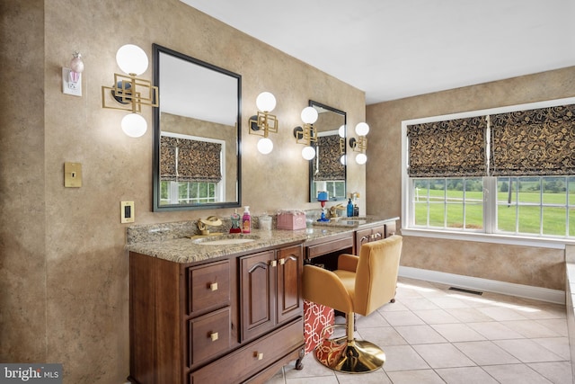 bathroom with tile patterned flooring and vanity