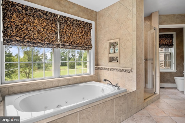 bathroom with plus walk in shower, tile patterned floors, and toilet