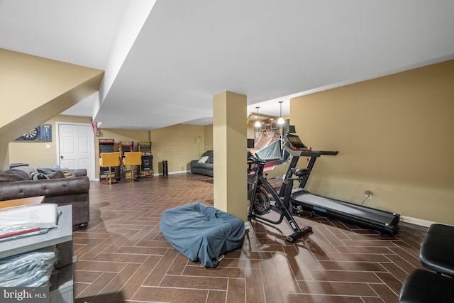 workout area with dark parquet flooring