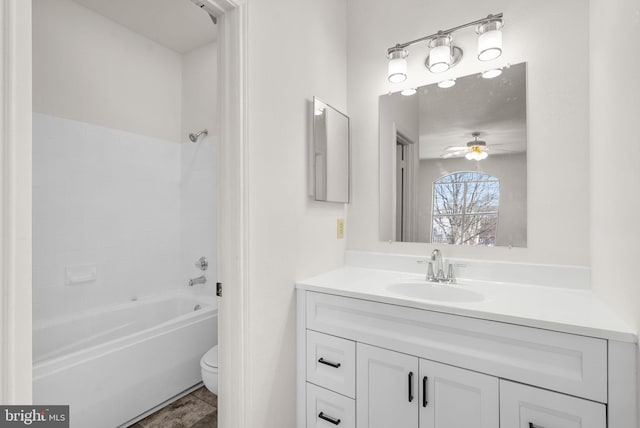 full bathroom with shower / bathing tub combination, vanity, toilet, and ceiling fan