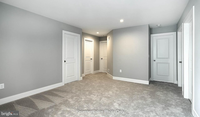 unfurnished bedroom with carpet flooring