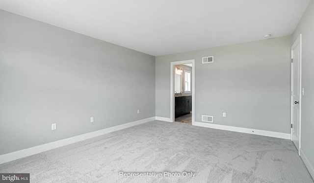 unfurnished room with carpet floors